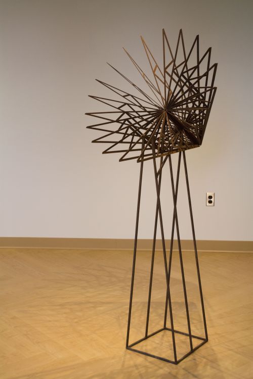 sculpture of thin sticks of wood