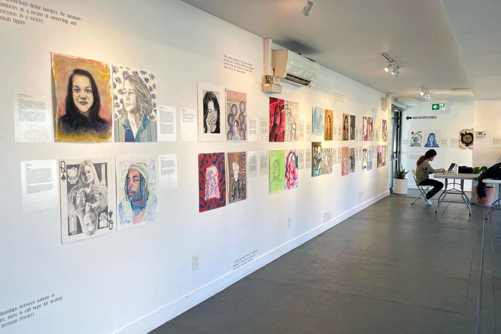 A photo showing an exhibition of the cross-border portrait project images.