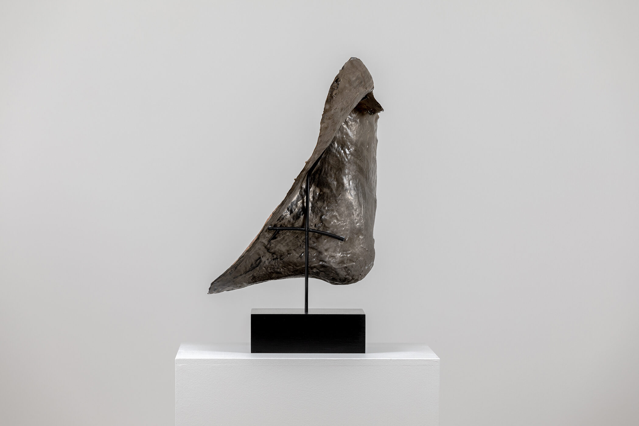 Spartan Skin (Prayer to Leonard Jungwirth); Cold-cast Nickel Silver, pigmented resin, acrylic paint, pigmented wax medium, steel, dyed walnut; 16” x 15” x 12”; 10” x 15” x 12” (with base)