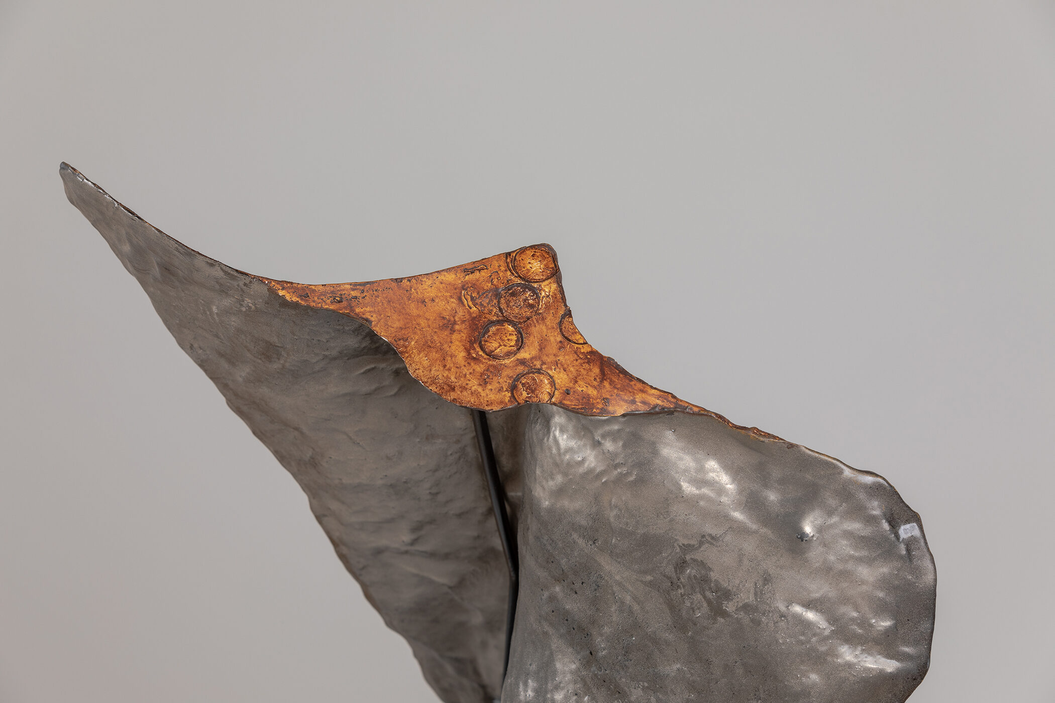Spartan Skin (Prayer to Leonard Jungwirth); Cold-cast Nickel Silver, pigmented resin, acrylic paint, pigmented wax medium, steel, dyed walnut; 16” x 15” x 12”; 10” x 15” x 12” (with base)