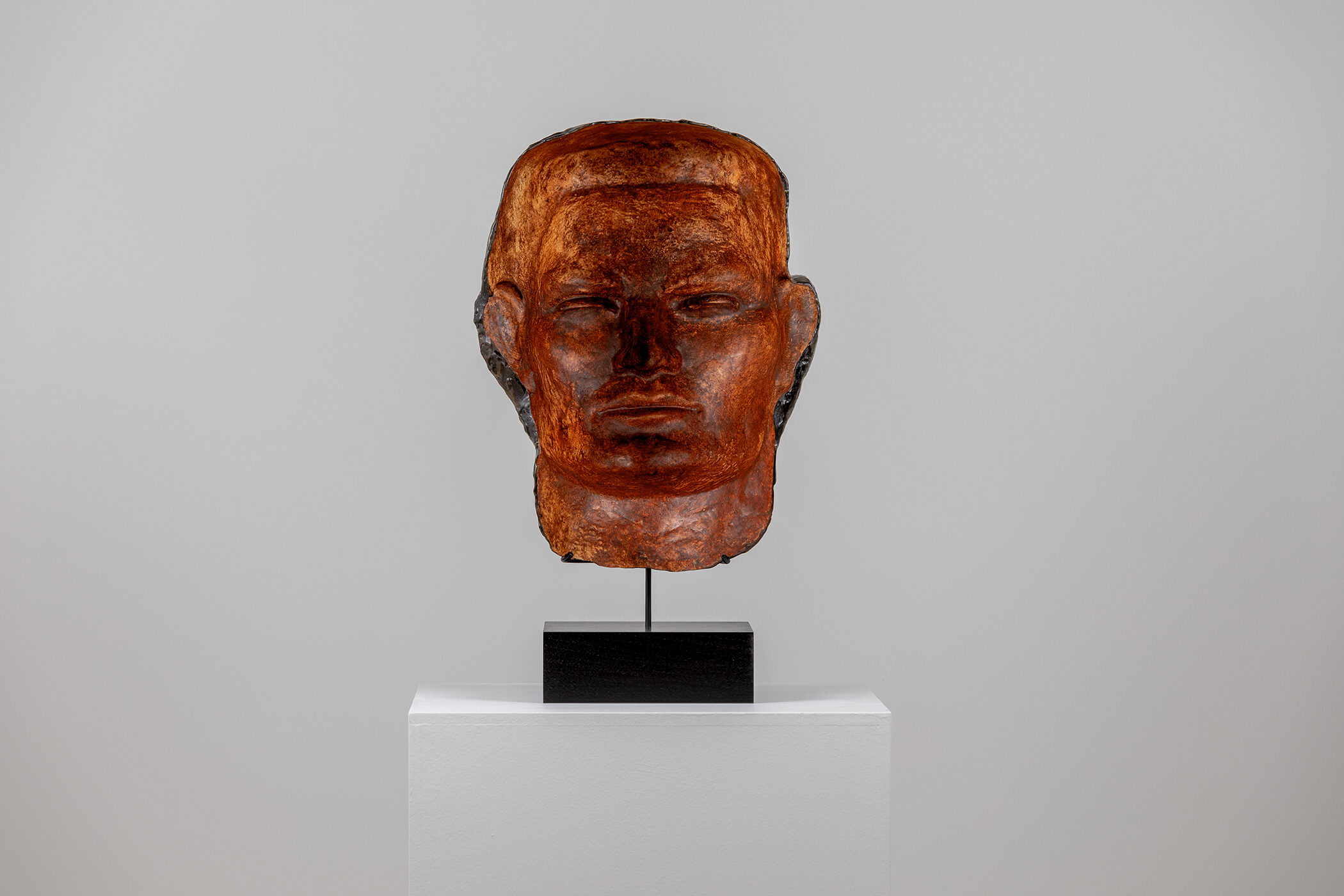 Spartan Skin (Face Mask); Cold-cast nickel silver, pigmented resin, acrylic paint, pigmented wax medium, steel, dyed walnut; 17” x 13” x 8 1⁄4”; 22 1⁄4” x 13” x 8 1⁄4” (with base)