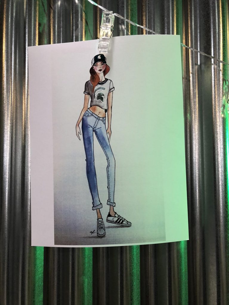 Sketch of girl with red hair wearing a green hat, a grey shirt, blue jeans, and white sneakers