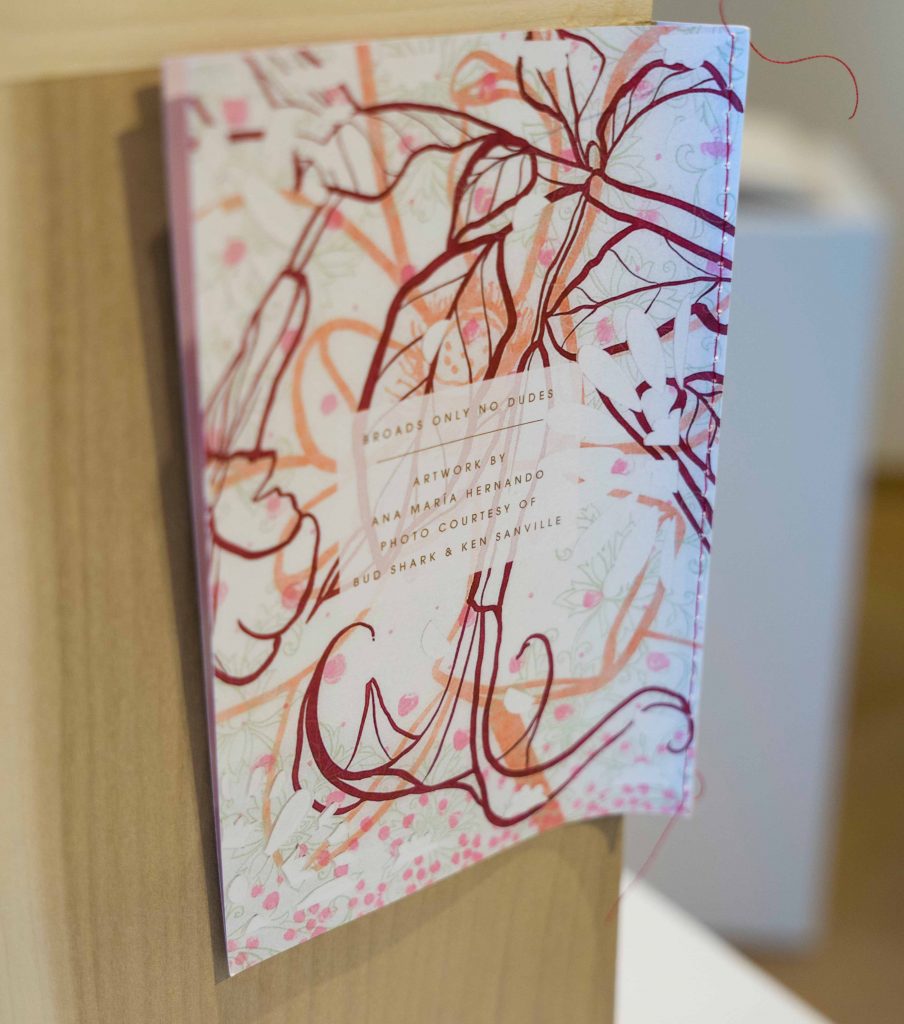 Book cover with illustrations of pink and red leaves 